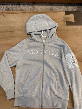 Moncler Light Grey Hoodie with Silver Logo and Metallic Sleeve Pocket